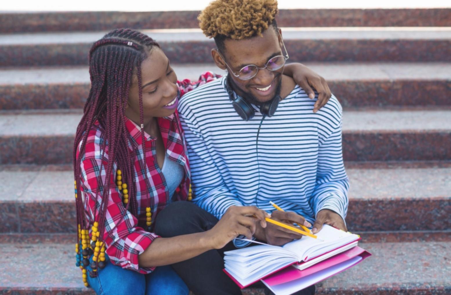 Student reviewing personal budget trends on laptop during workshop